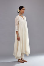 Off white Cotton Chanderi panelled and asymmetric hem long kurta set with off-white thread and mirror embroidery.