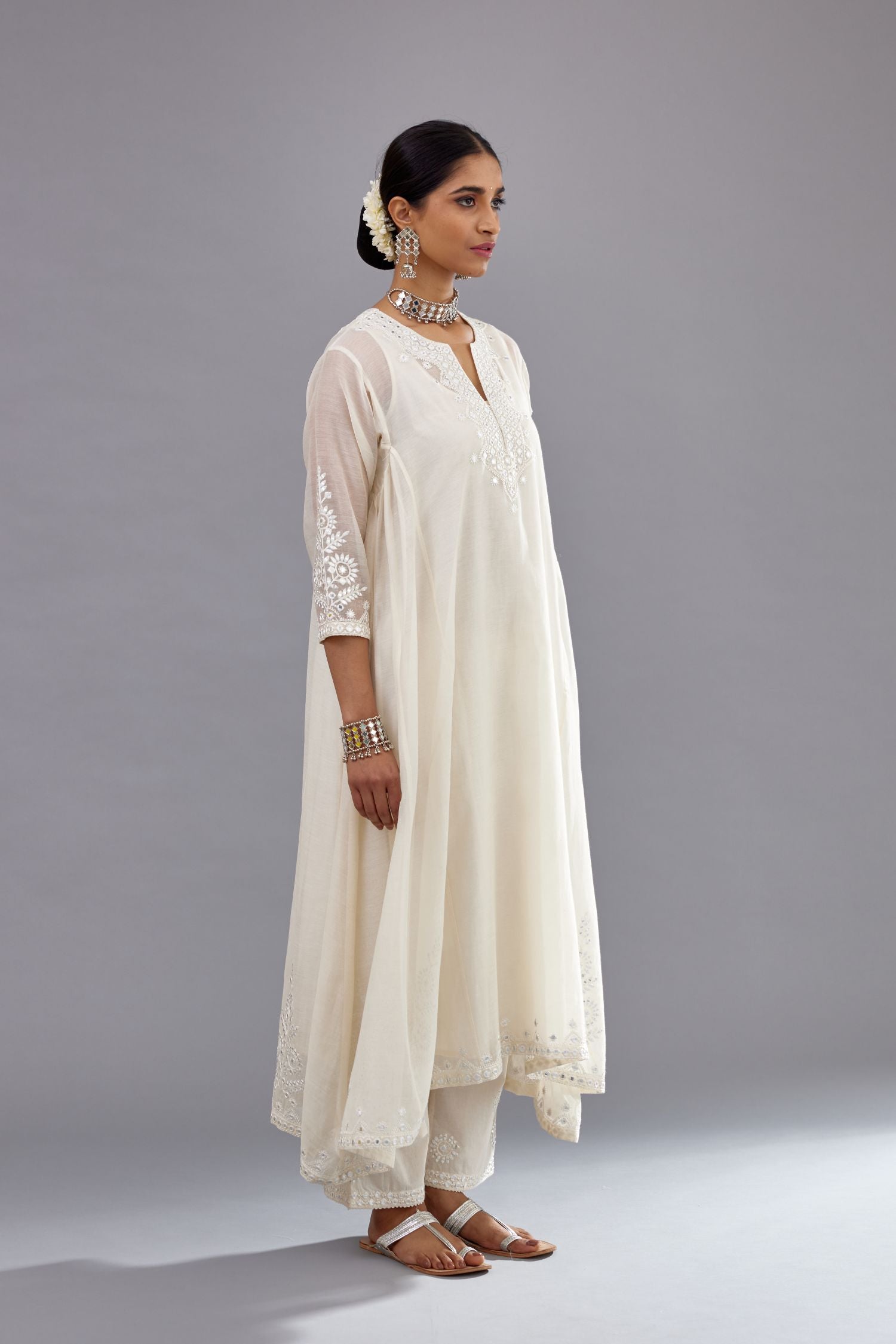 Off white Cotton Chanderi panelled and asymmetric hem long kurta set with off-white thread and mirror embroidery.