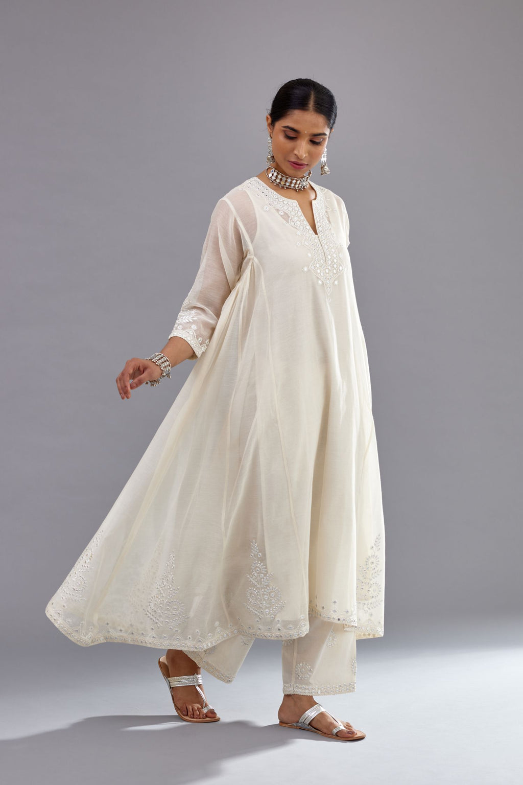Off white Cotton Chanderi panelled and asymmetric hem long kurta set with off-white thread and mirror embroidery.