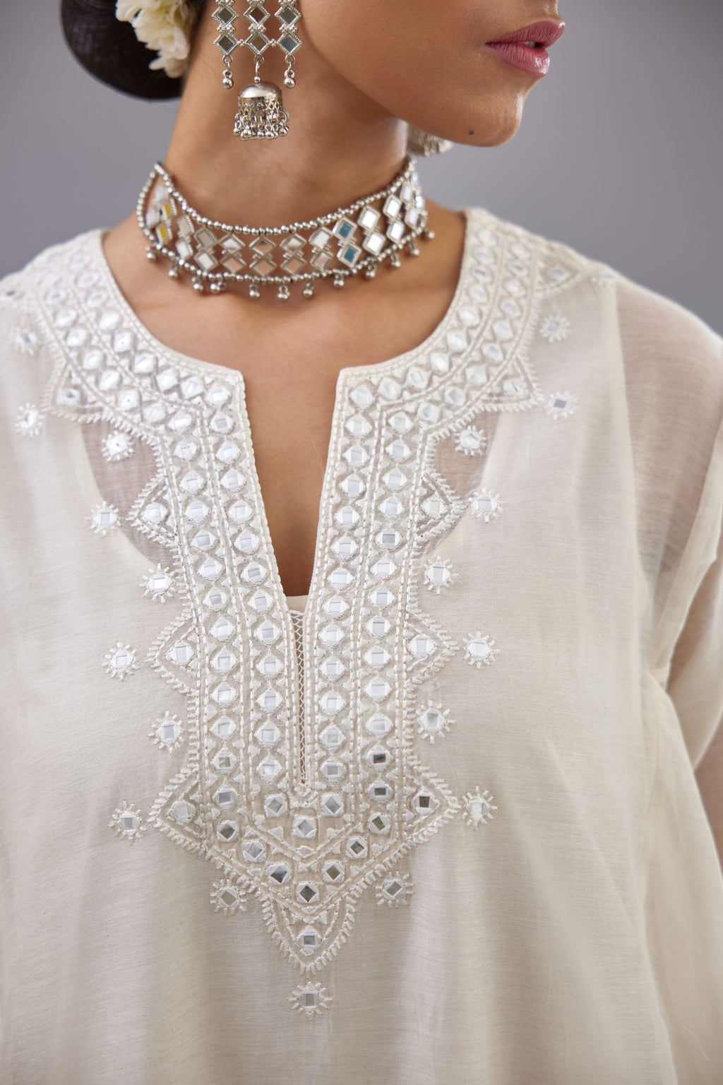 Off white Cotton Chanderi panelled and asymmetric hem long kurta set with off-white thread and mirror embroidery.