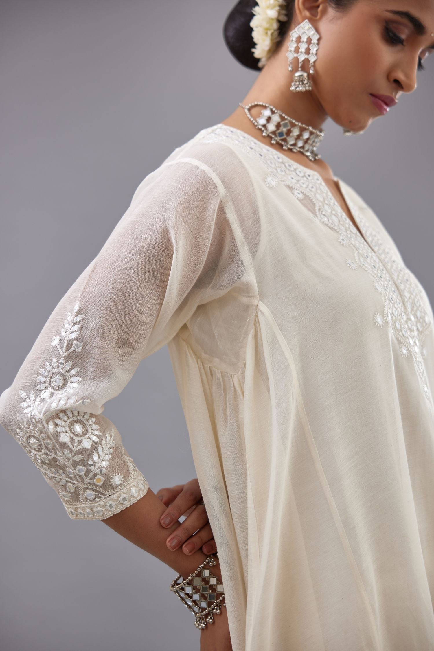Off white Cotton Chanderi panelled and asymmetric hem long kurta set with off-white thread and mirror embroidery.