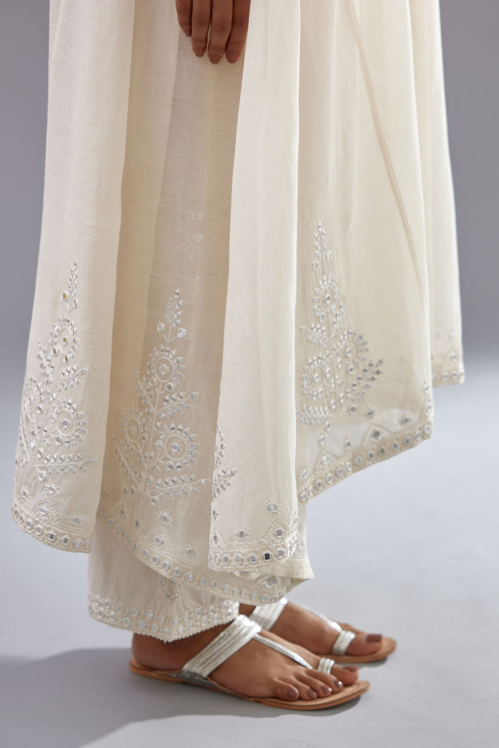 Off white Cotton Chanderi panelled and asymmetric hem long kurta set with off-white thread and mirror embroidery.