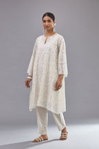 Off white short easy fit, straight hem kurta set with all-over trellis jaal appliqué, highlighted with sequins.