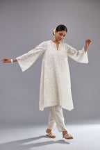 Off white short easy fit, straight hem kurta set with all-over trellis jaal appliqué, highlighted with sequins.