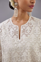 Off white short easy fit, straight hem kurta set with all-over trellis jaal appliqué, highlighted with sequins.