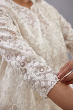 Off white short easy fit, straight hem kurta set with all-over trellis jaal appliqué, highlighted with sequins.