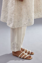 Off white short easy fit, straight hem kurta set with all-over trellis jaal appliqué, highlighted with sequins.