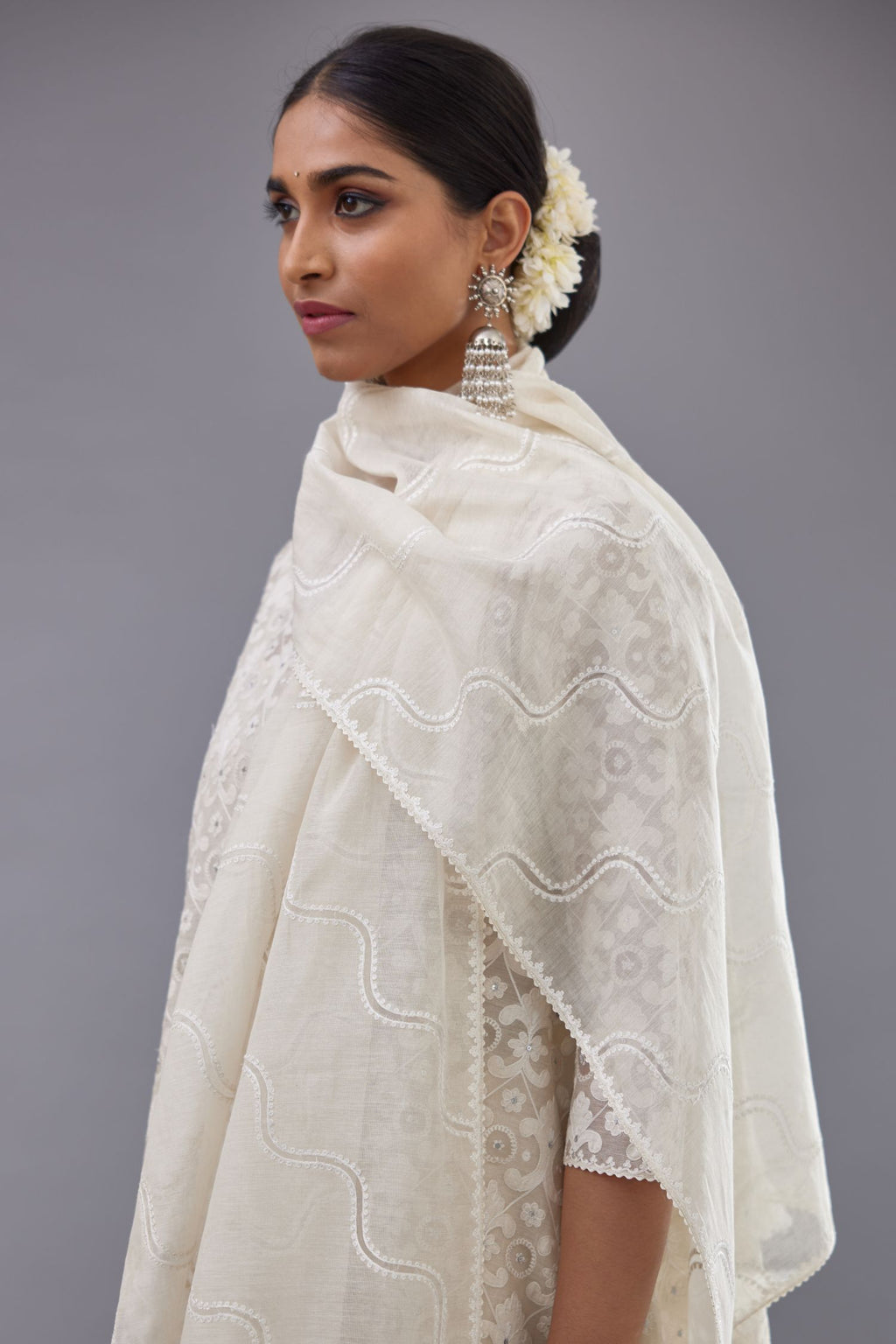 Off white Cotton Chanderi Dupatta with diagonal embroidered stripes with organza and single line emboidery at edges.