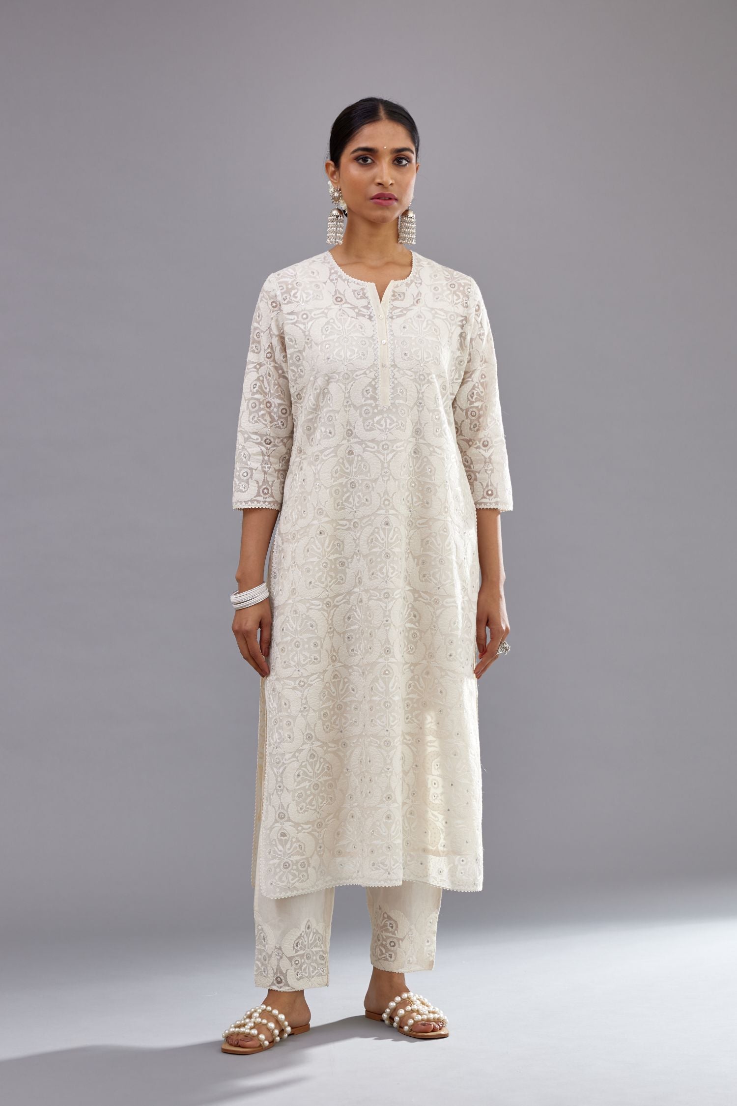 Off white straight kurta set with all-over cotton appliqué trellis jaal, highlighted with sequins.