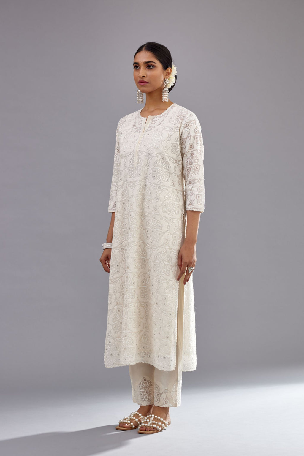 Off white straight kurta set with all-over cotton appliqué trellis jaal, highlighted with sequins.