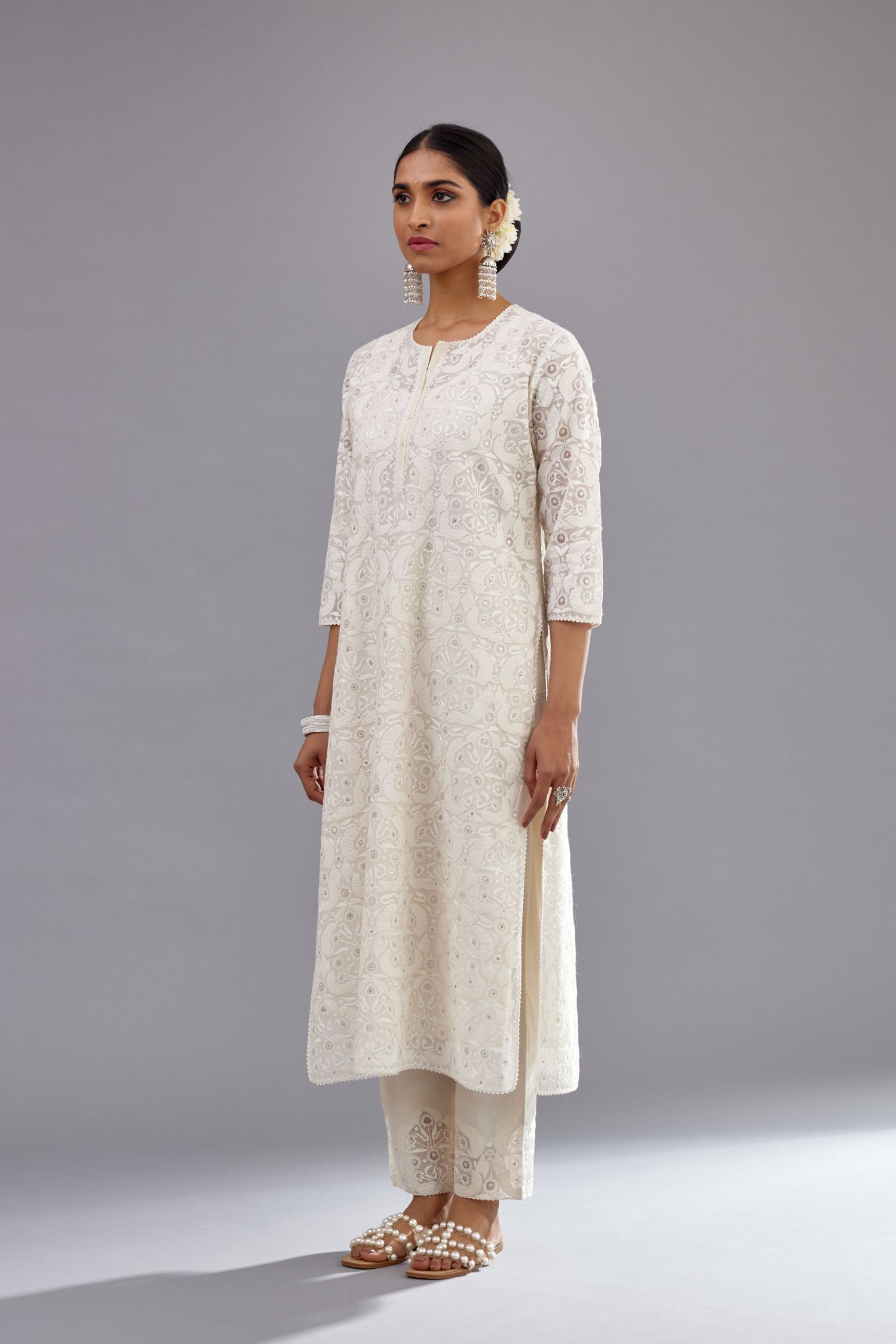 Off white straight kurta set with all-over cotton appliqué trellis jaal, highlighted with sequins.