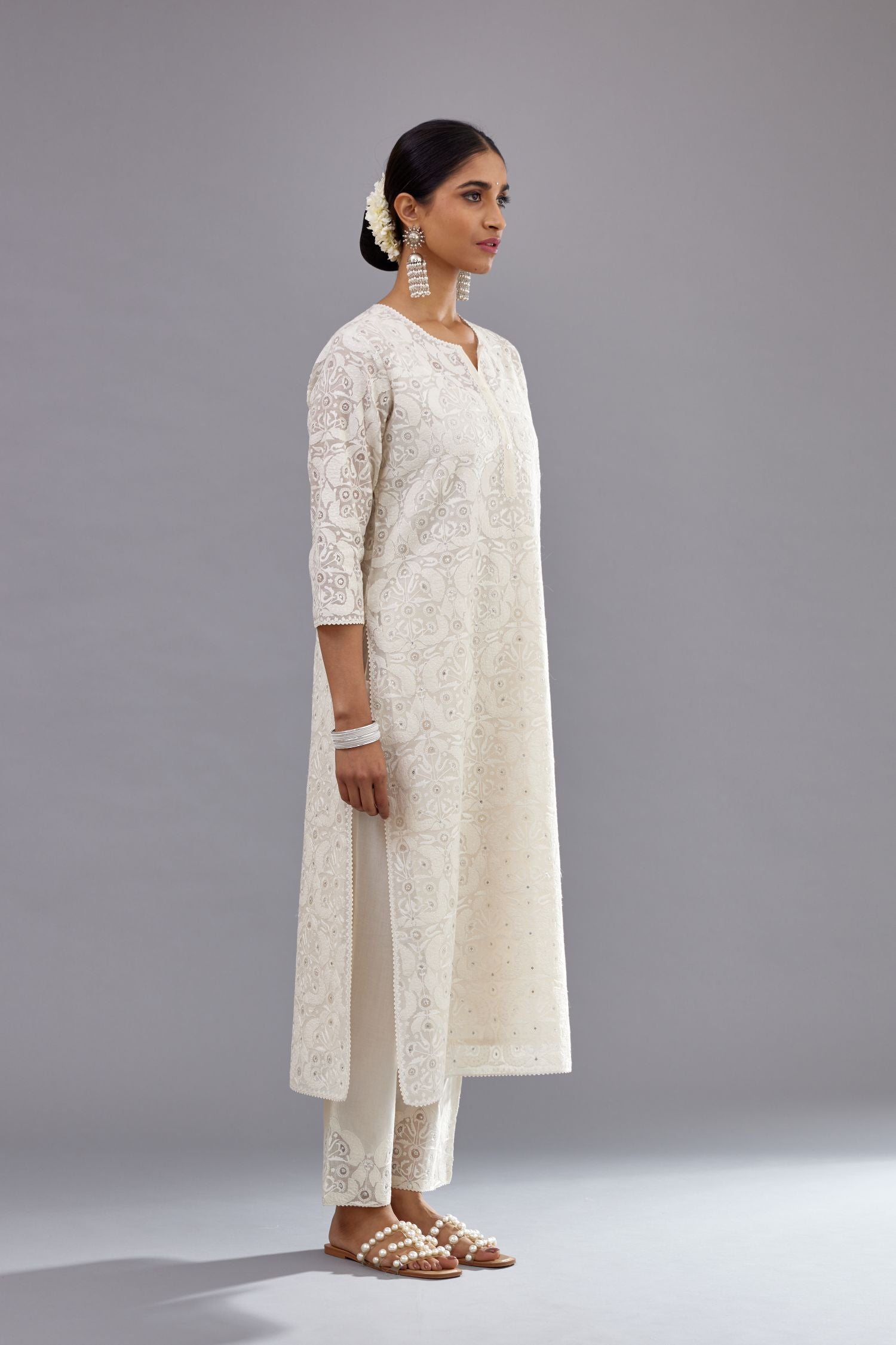 Off white straight kurta set with all-over cotton appliqué trellis jaal, highlighted with sequins.