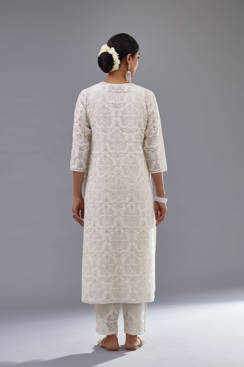 Off white straight kurta set with all-over cotton appliqué trellis jaal, highlighted with sequins.