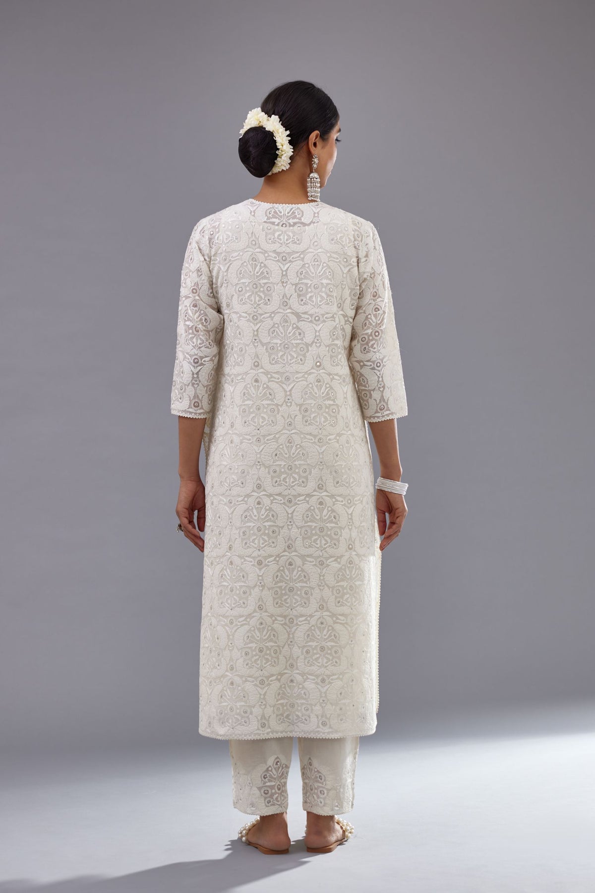Off white straight kurta set with all-over cotton appliqué trellis jaal, highlighted with sequins.