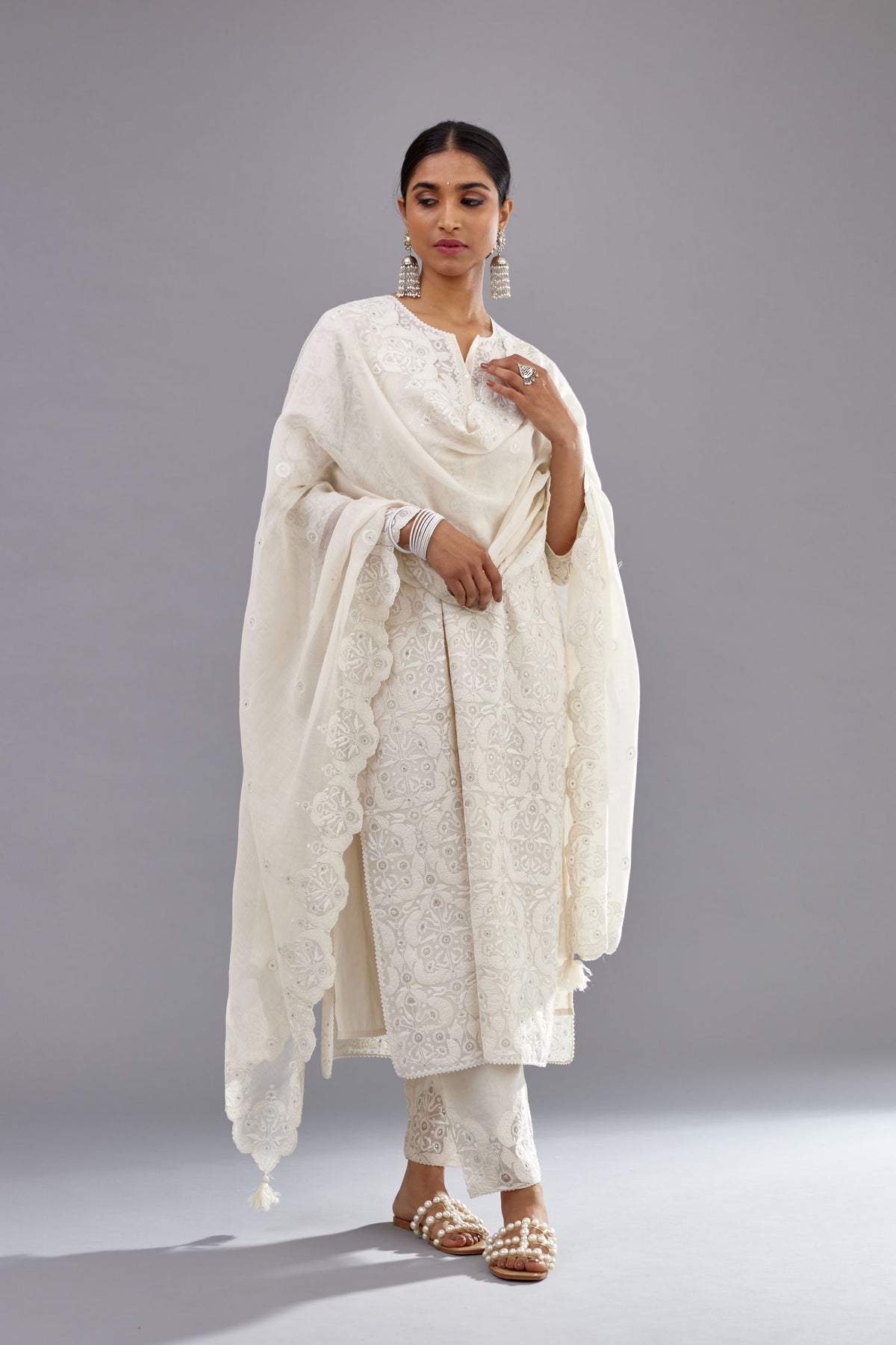 Off white straight kurta set with all-over cotton appliqué trellis jaal, highlighted with sequins.