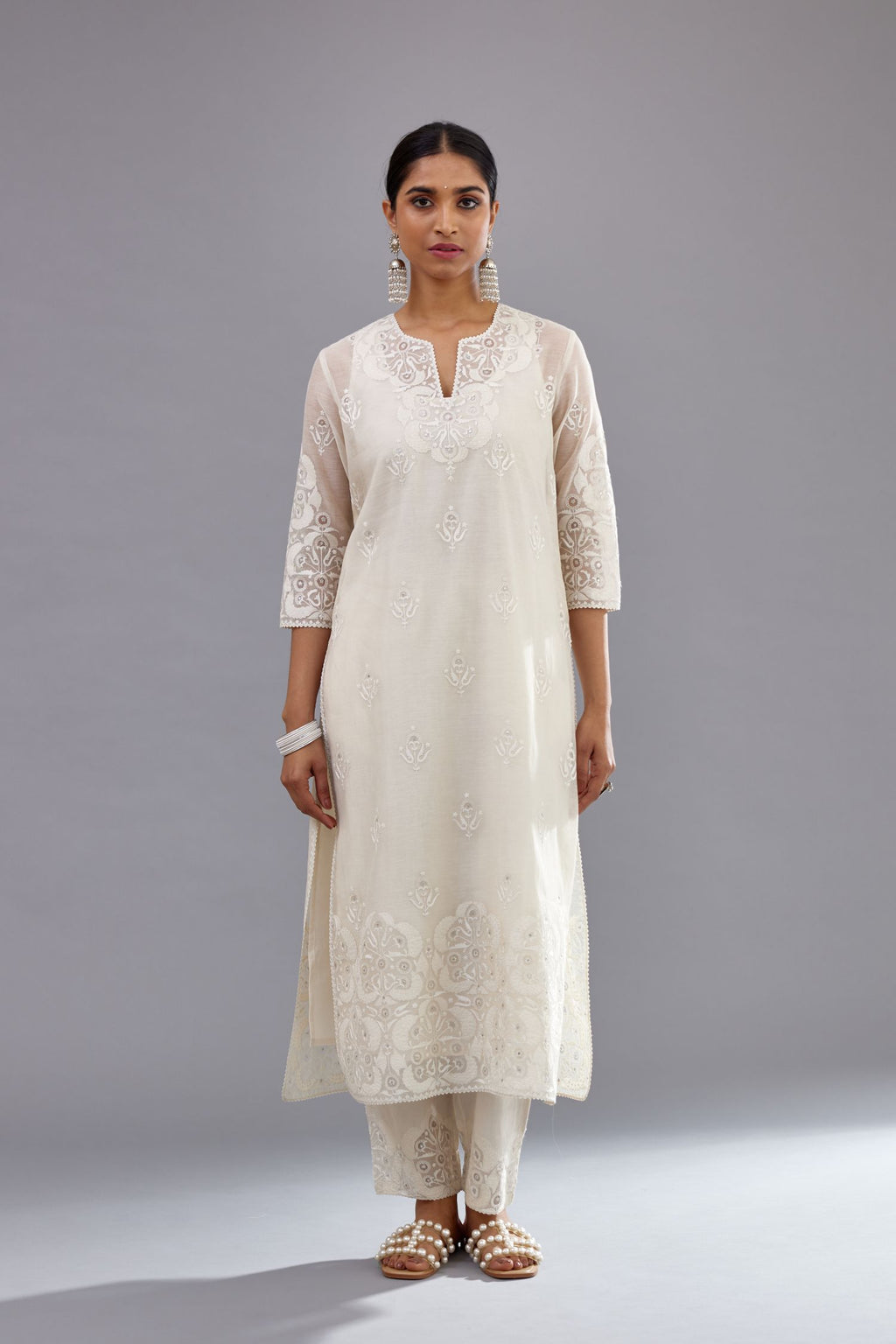 Off white cotton chanderi straight kurta set with cotton appliqué, highlighted with sequins.