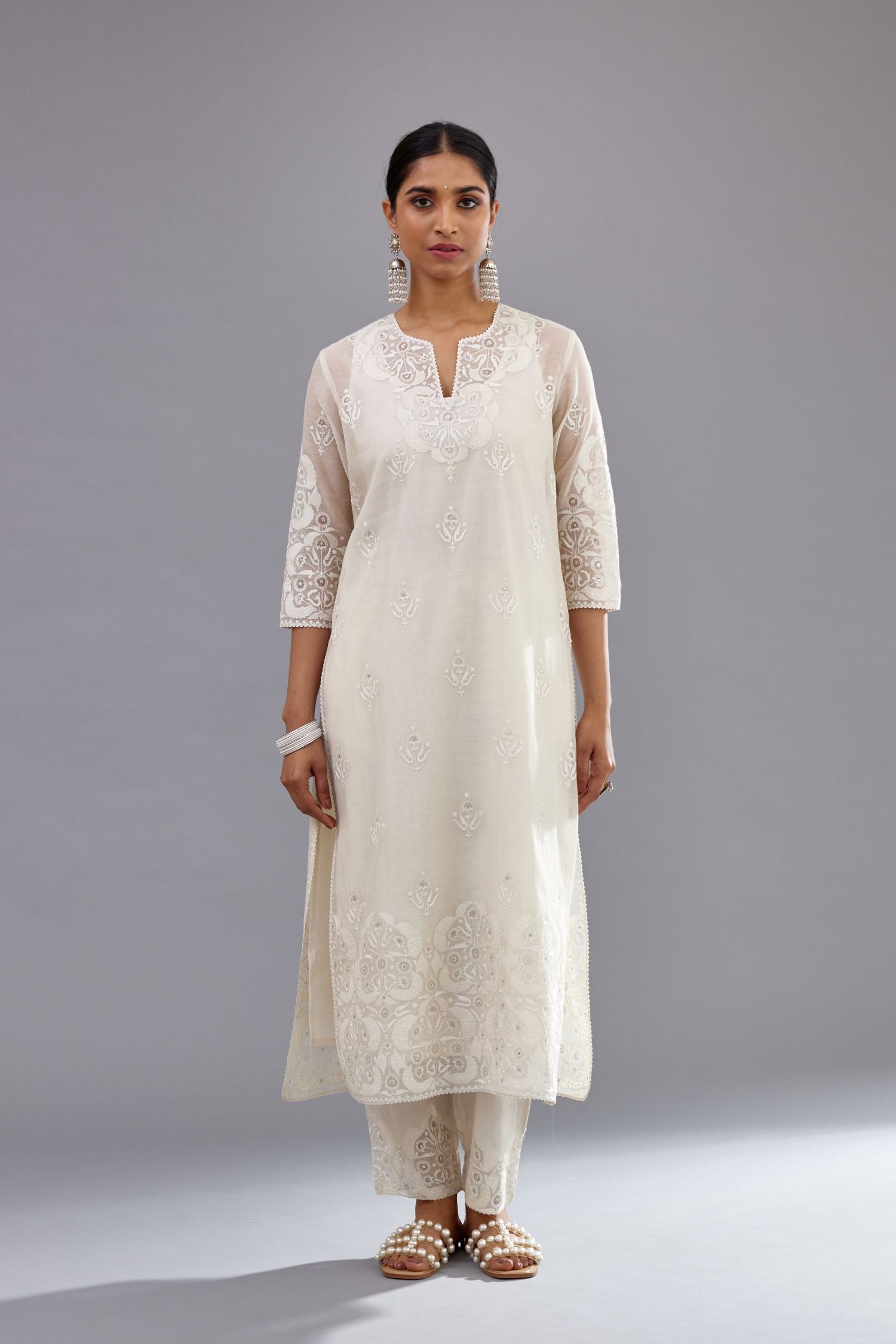 Off white cotton chanderi straight kurta set with cotton appliqué, highlighted with sequins.