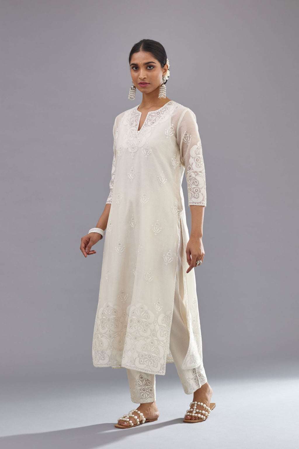 Off white cotton chanderi straight kurta set with cotton appliqué, highlighted with sequins.