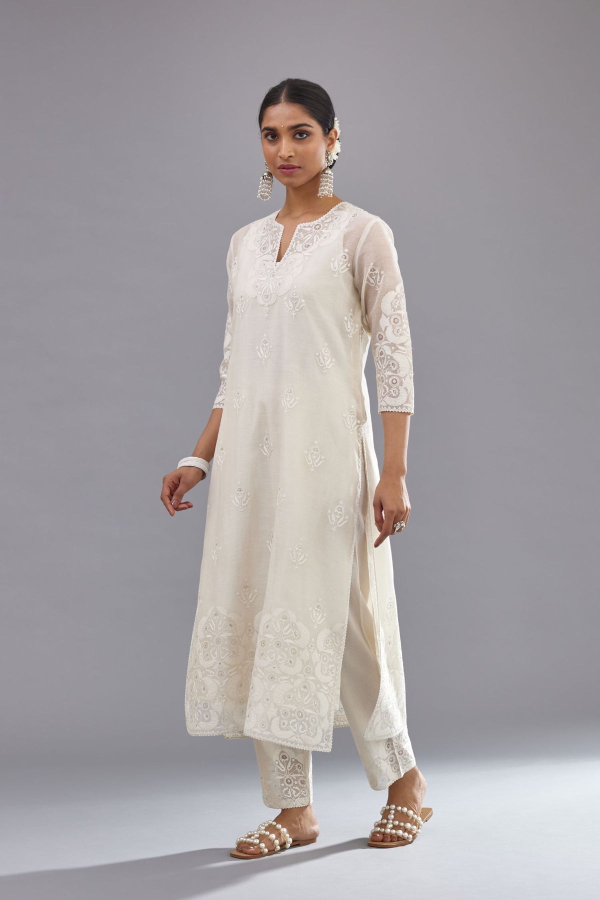 Off white cotton chanderi straight kurta set with cotton appliqué, highlighted with sequins.
