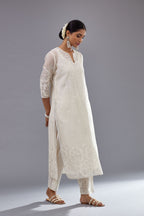 Off white cotton chanderi straight kurta set with cotton appliqué, highlighted with sequins.