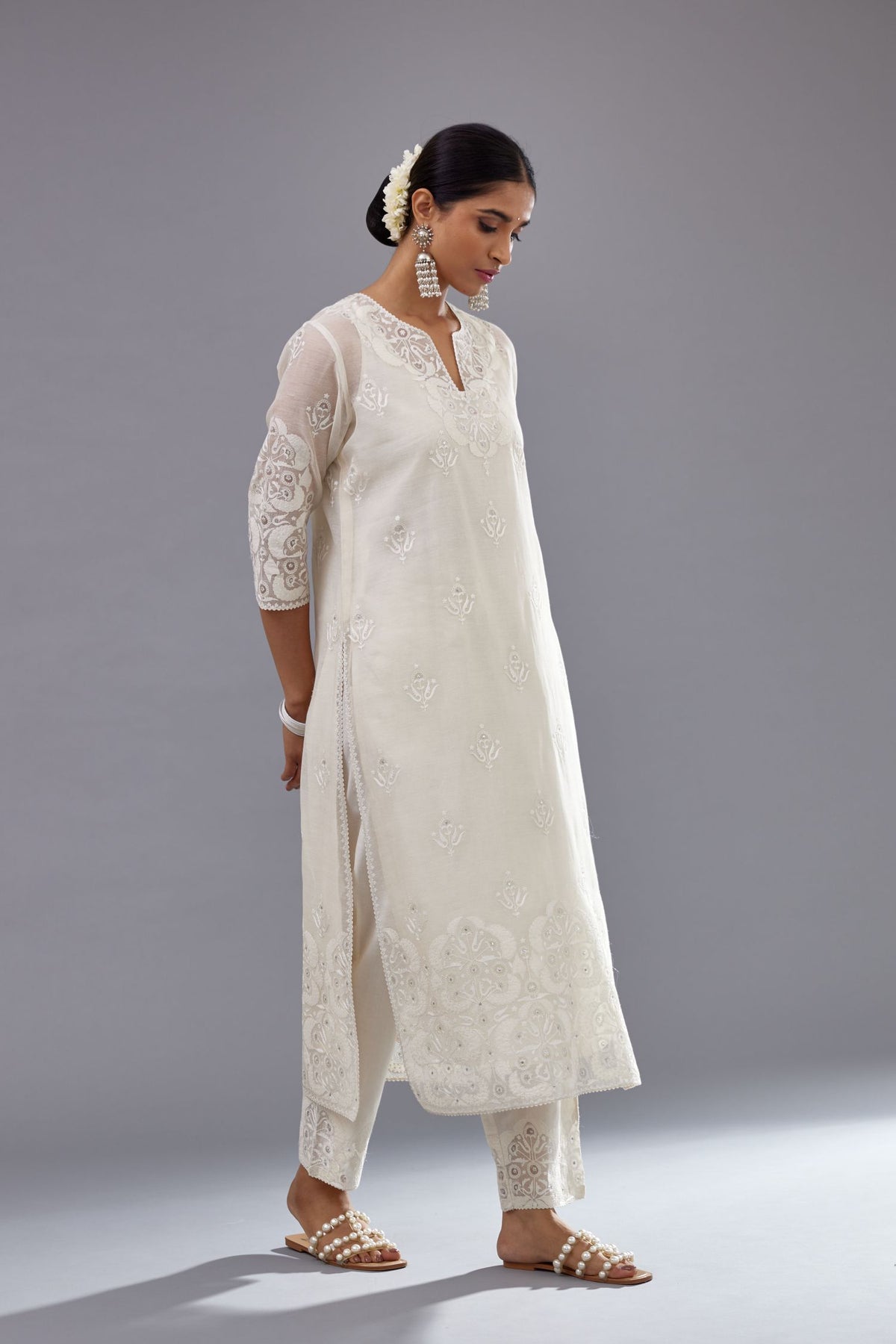 Off white cotton chanderi straight kurta set with cotton appliqué, highlighted with sequins.
