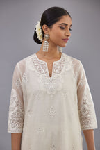 Off white cotton chanderi straight kurta set with cotton appliqué, highlighted with sequins.