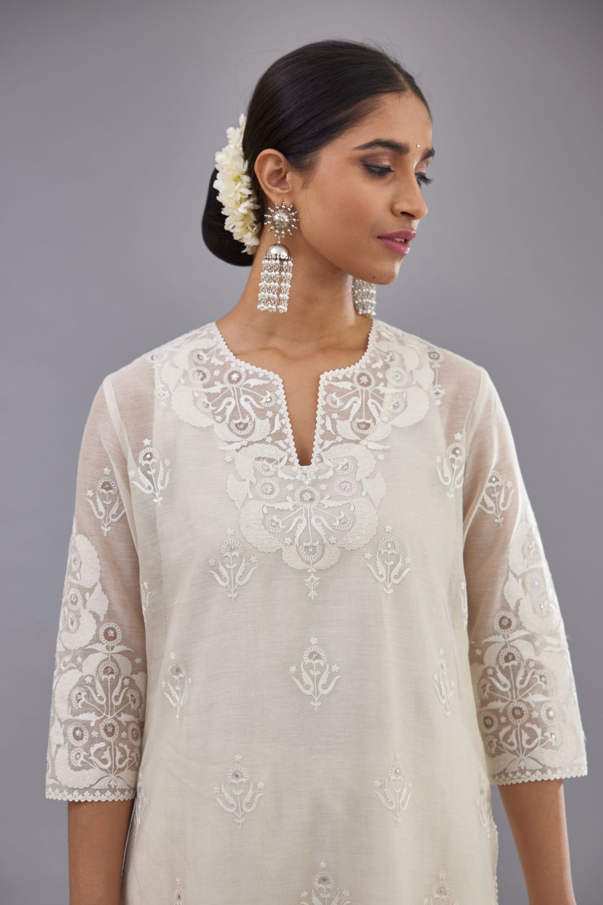 Off white cotton chanderi straight kurta set with cotton appliqué, highlighted with sequins.