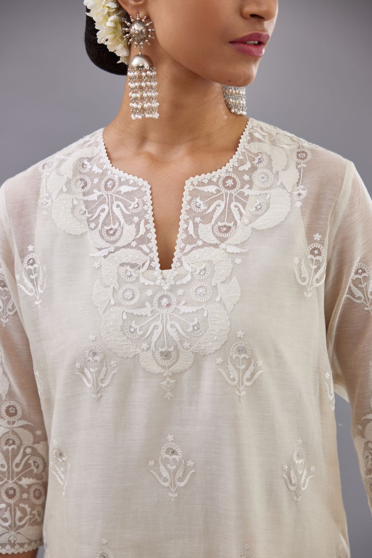 Off white cotton chanderi straight kurta set with cotton appliqué, highlighted with sequins.
