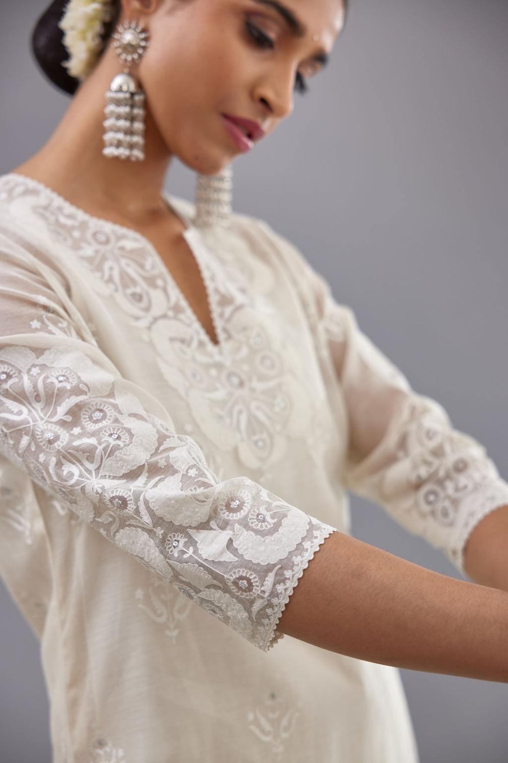 Off white cotton chanderi straight kurta set with cotton appliqué, highlighted with sequins.