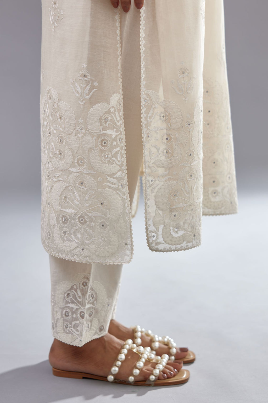 Off white cotton chanderi straight kurta set with cotton appliqué, highlighted with sequins.