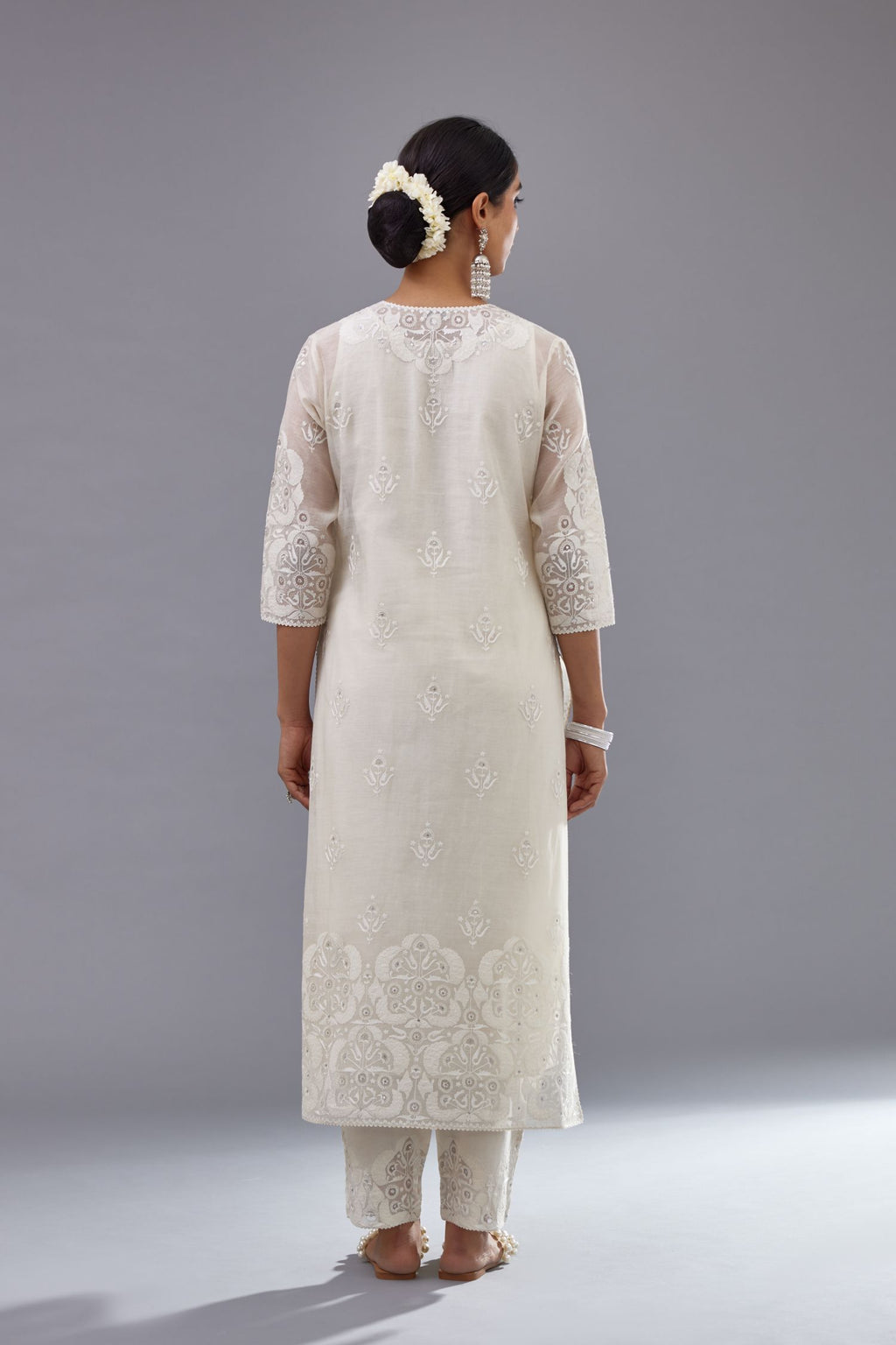 Off white cotton chanderi straight kurta set with cotton appliqué, highlighted with sequins.