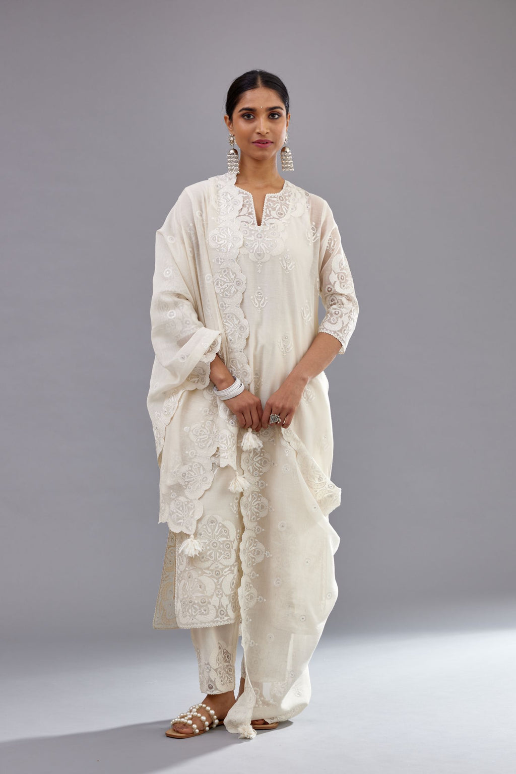 Off white cotton chanderi straight kurta set with cotton appliqué, highlighted with sequins.