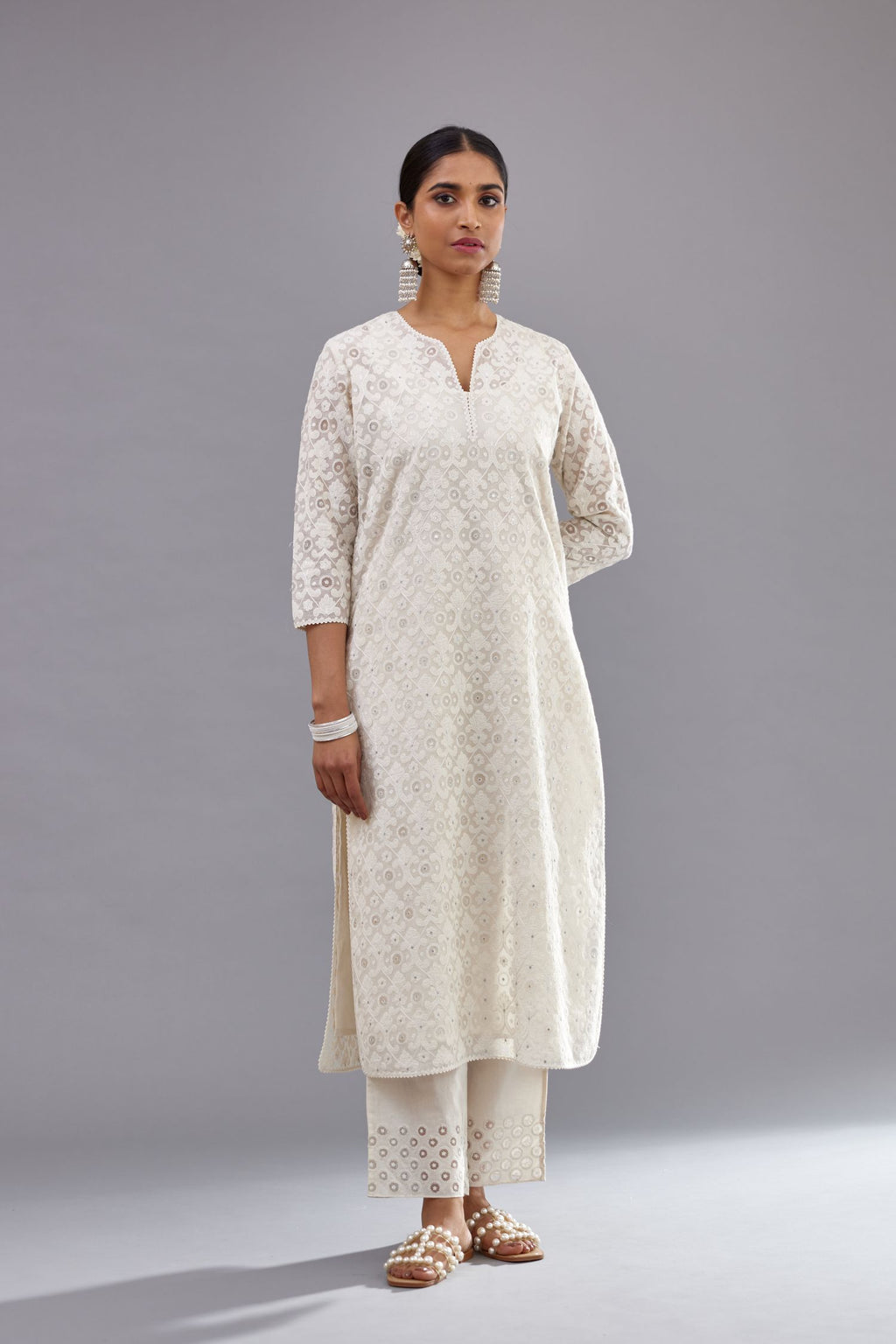 Off white straight kurta set with all-over cotton appliqué trellis jaal, highlighted with sequins.
