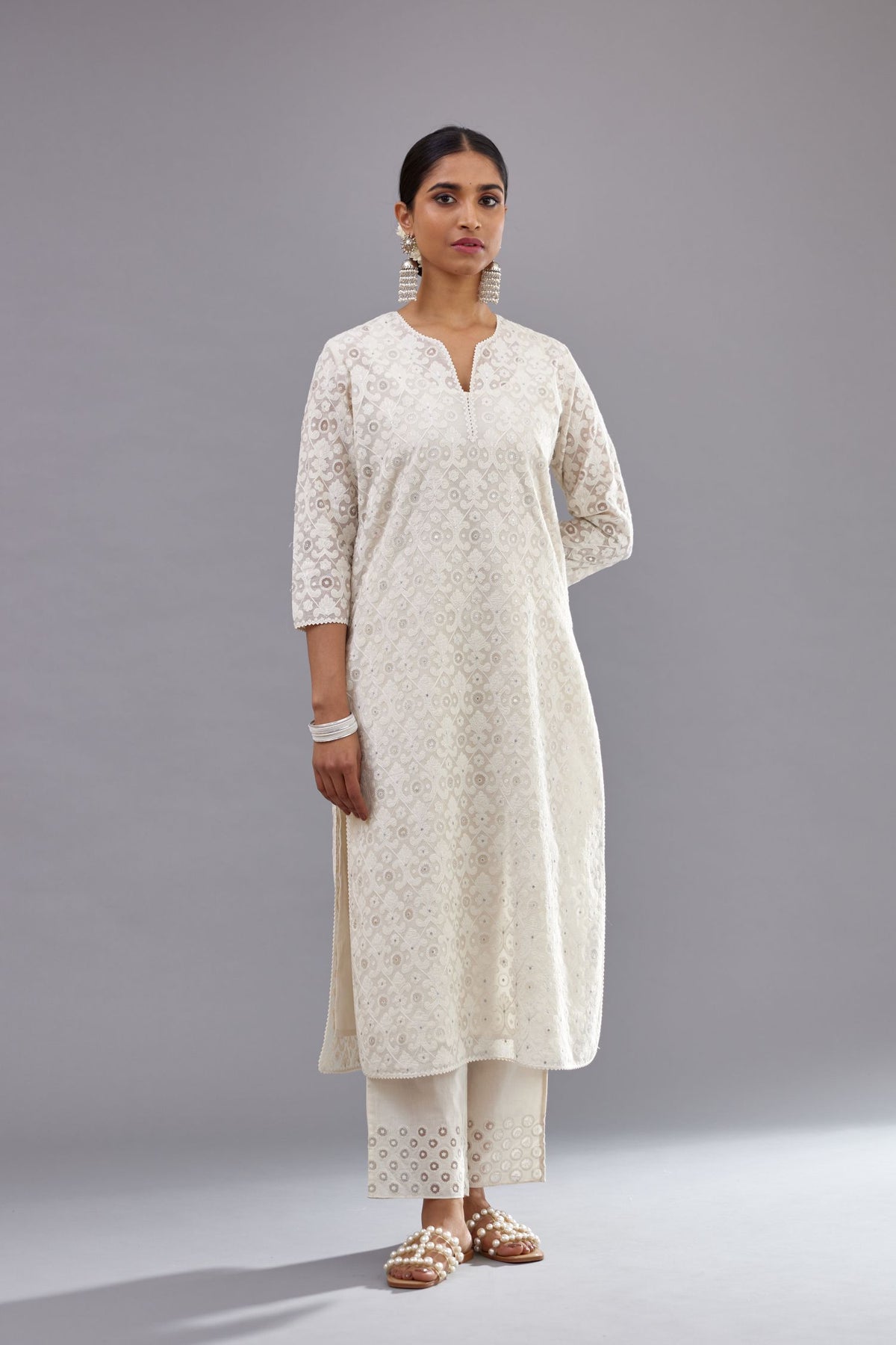 Off white straight kurta set with all-over cotton appliqué trellis jaal, highlighted with sequins.