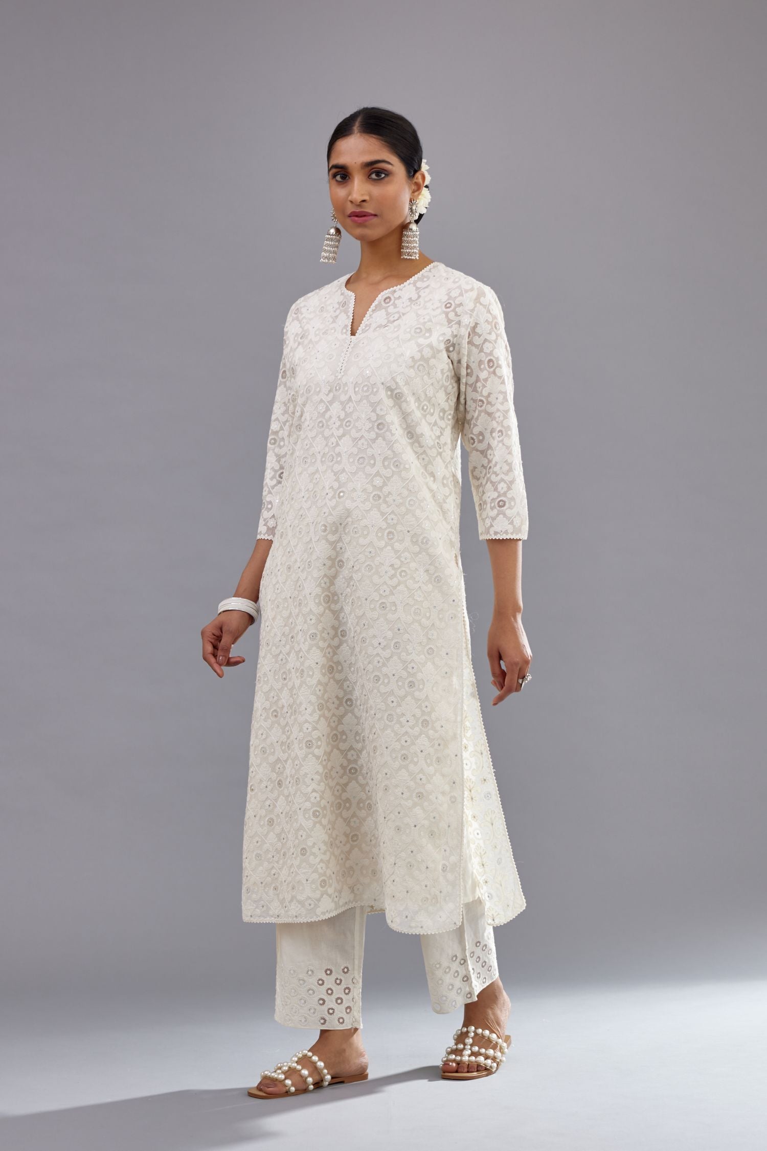 Off white straight kurta set with all-over cotton appliqué trellis jaal, highlighted with sequins.