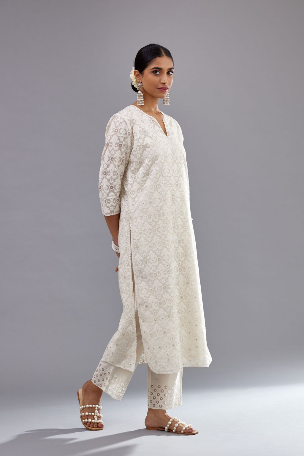 Off white straight kurta set with all-over cotton appliqué trellis jaal, highlighted with sequins.