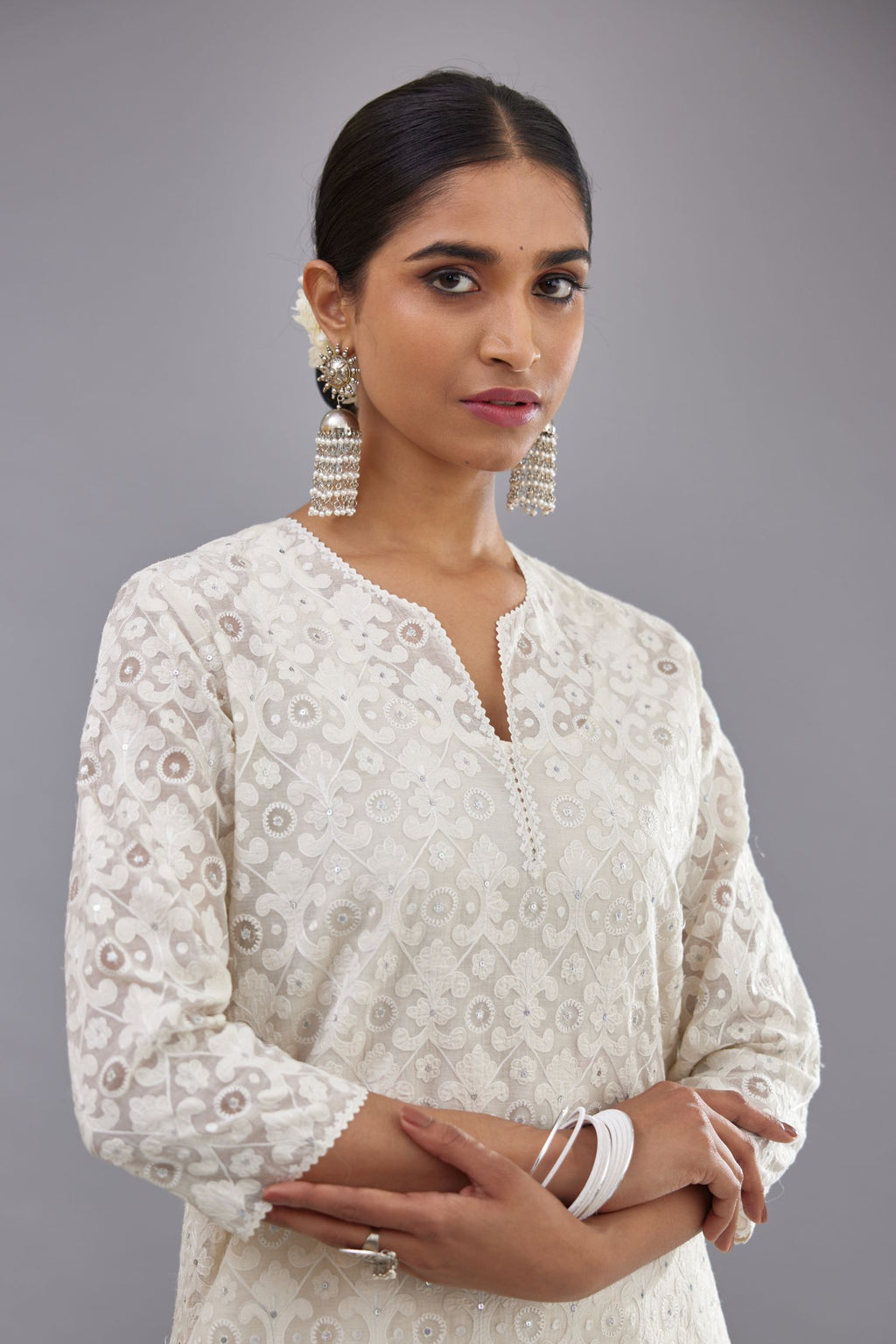 Off white straight kurta set with all-over cotton appliqué trellis jaal, highlighted with sequins.