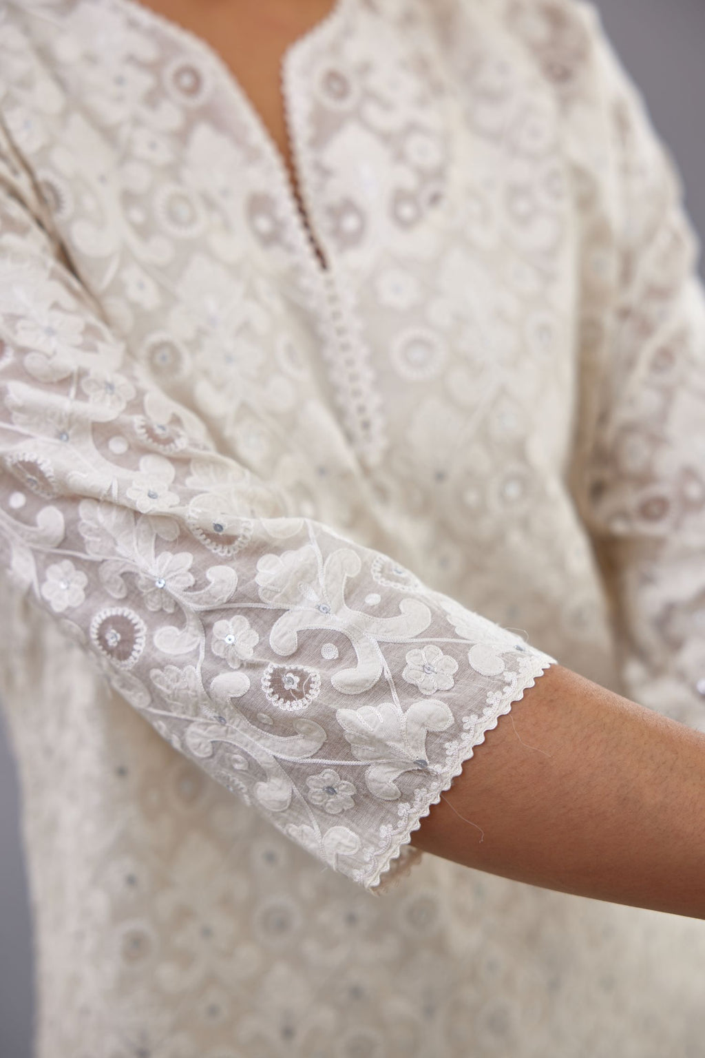 Off white straight kurta set with all-over cotton appliqué trellis jaal, highlighted with sequins.
