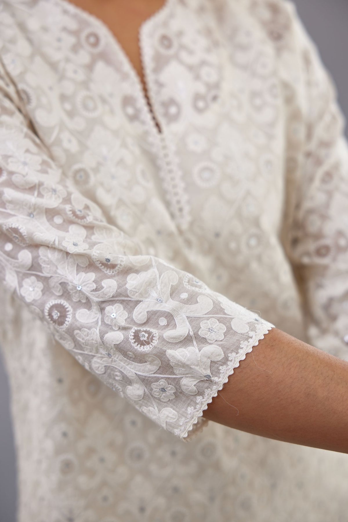 Off white straight kurta set with all-over cotton appliqué trellis jaal, highlighted with sequins.
