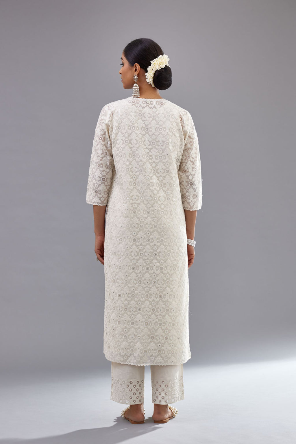 Off white straight kurta set with all-over cotton appliqué trellis jaal, highlighted with sequins.