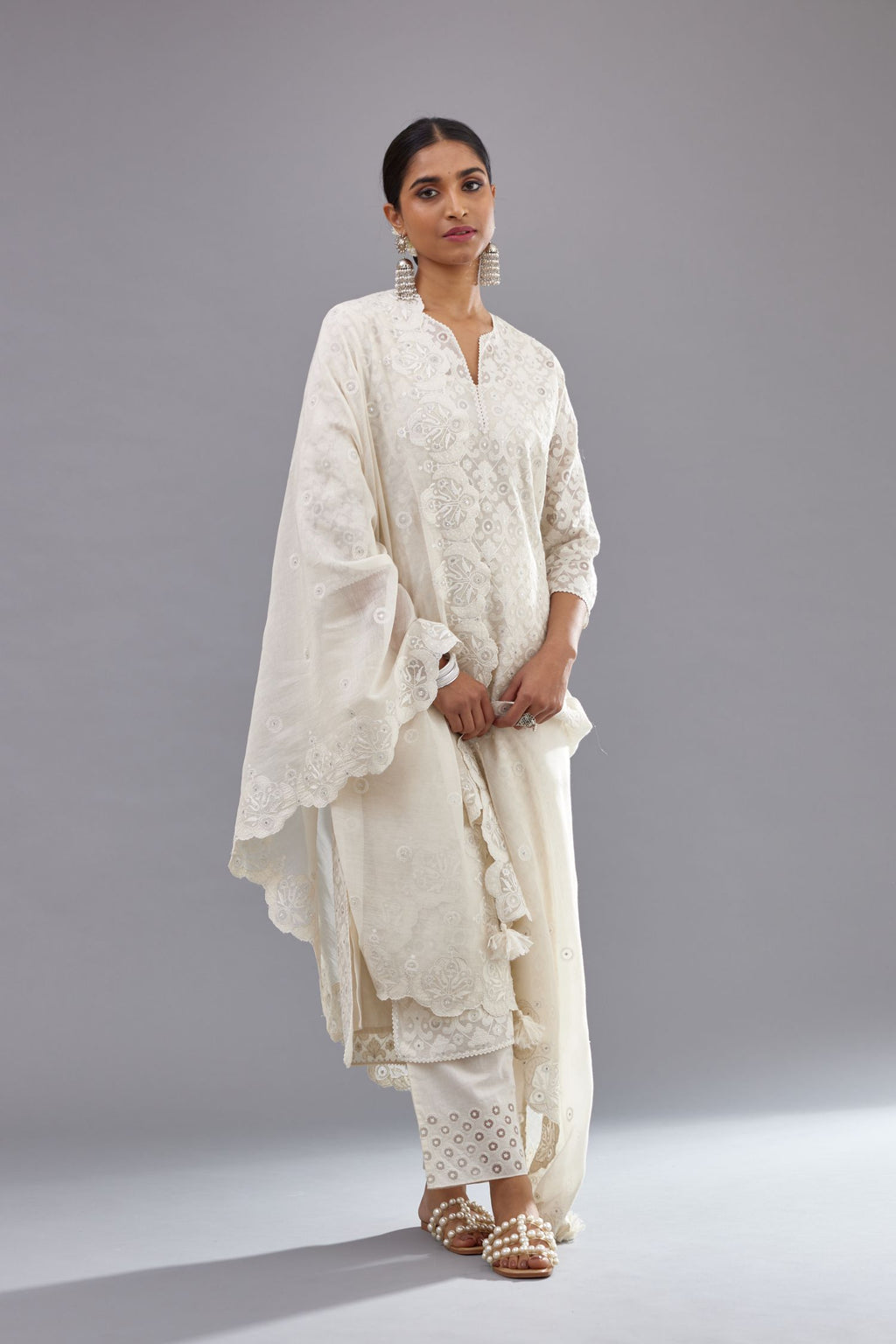 Off white straight kurta set with all-over cotton appliqué trellis jaal, highlighted with sequins.