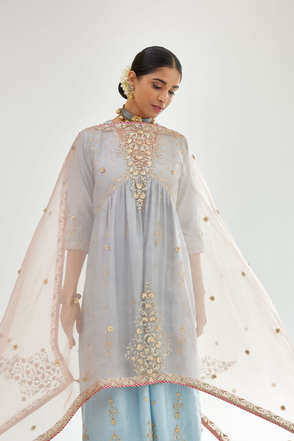 Blue silk chanderi kurta-dress set with zari, dori and gota embroidery, highlighted with contrast bead work.