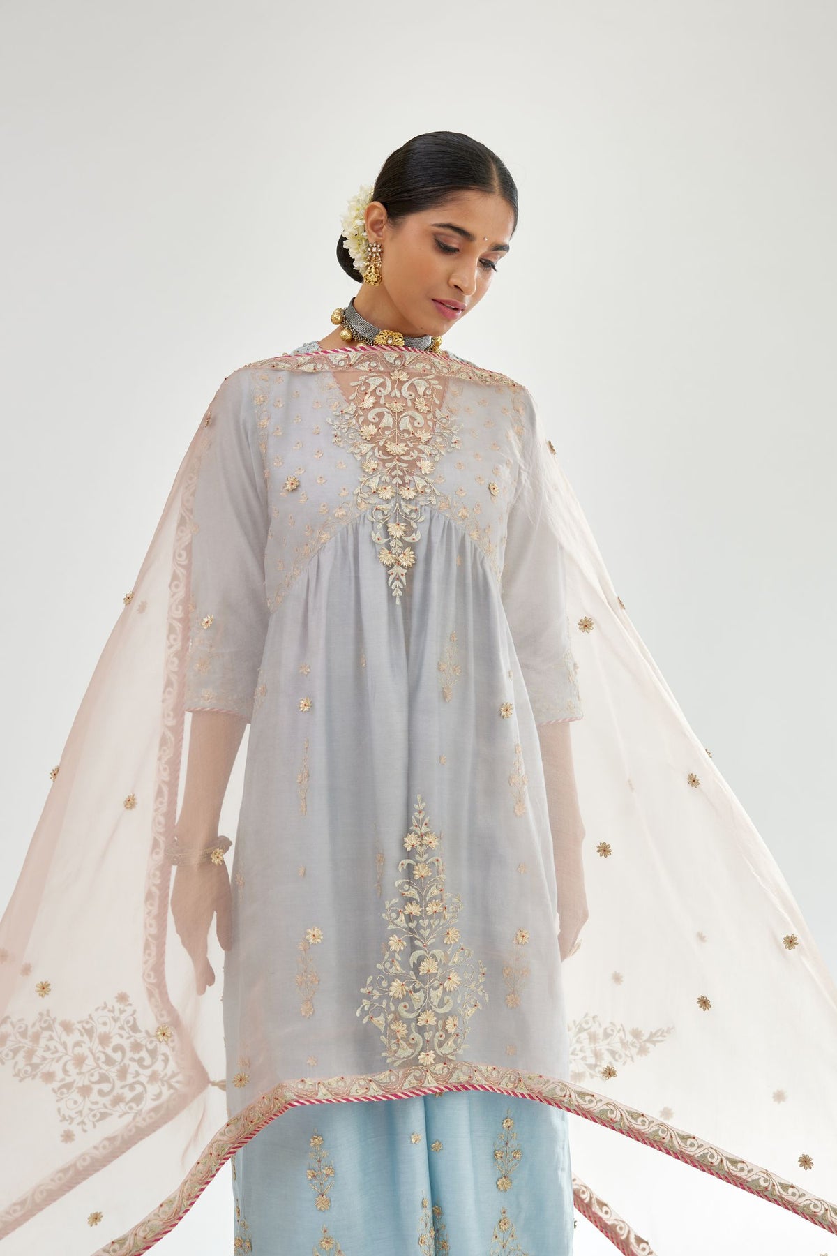 Blue silk chanderi kurta-dress set with zari, dori and gota embroidery, highlighted with contrast bead work.