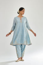 Blue silk chanderi short kalidar kurta set with all-over delicate zari bootis, detailed with dori embroidery and contrast bead work.