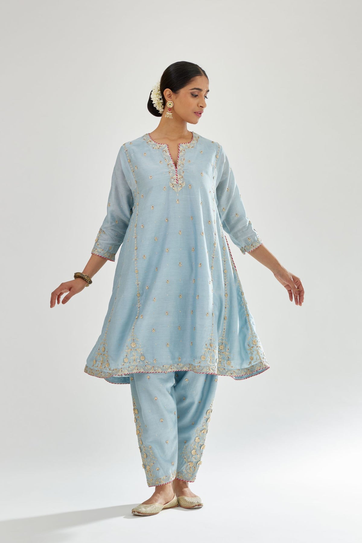 Blue silk chanderi short kalidar kurta set with all-over delicate zari bootis, detailed with dori embroidery and contrast bead work.