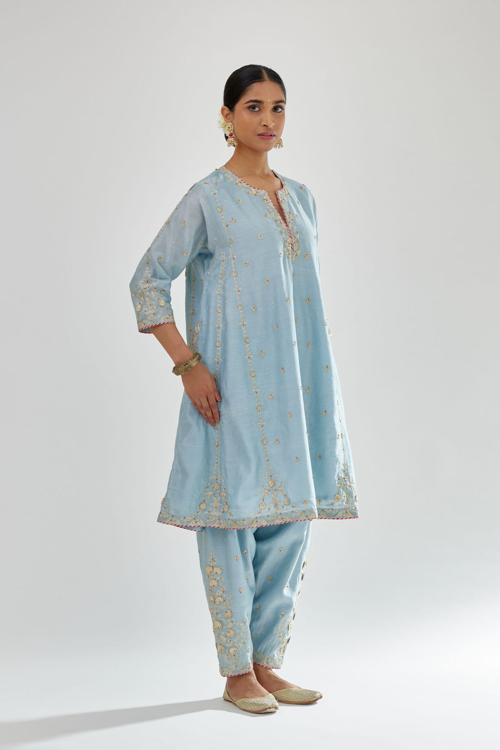 Blue silk chanderi short kalidar kurta set with all-over delicate zari bootis, detailed with dori embroidery and contrast bead work.