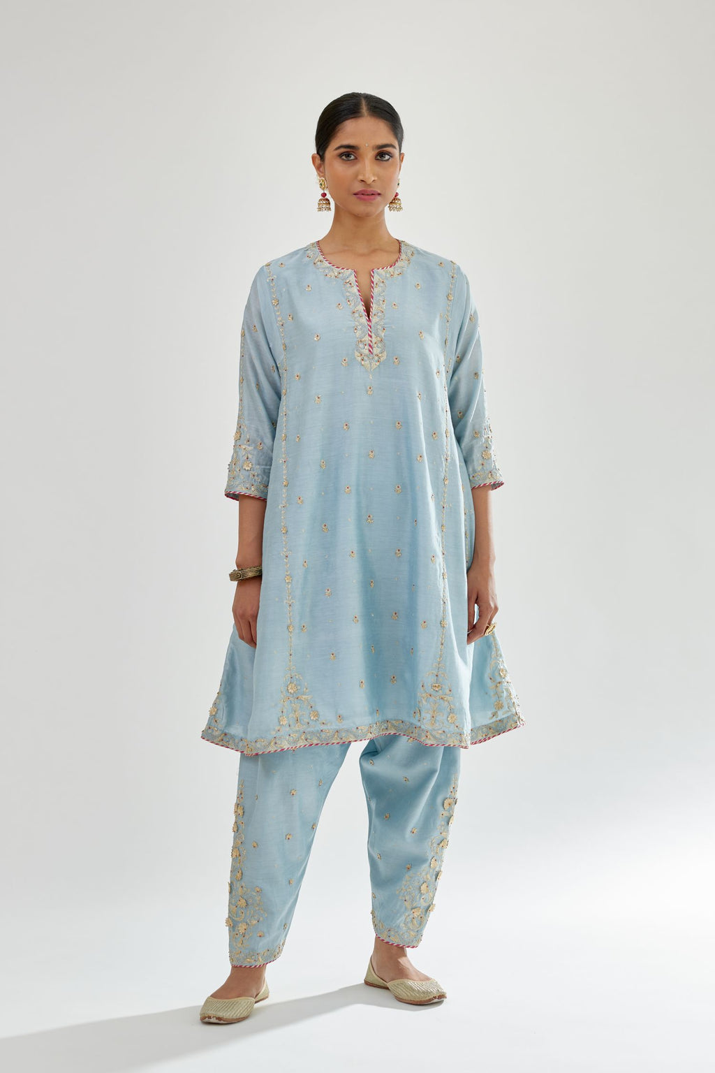 Blue silk chanderi short kalidar kurta set with all-over delicate zari bootis, detailed with dori embroidery and contrast bead work.