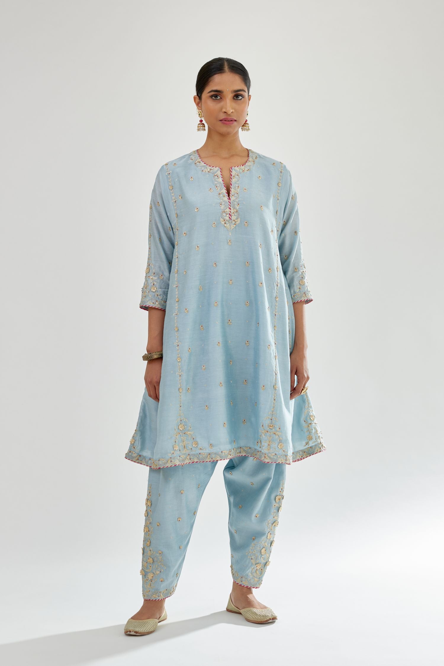 Blue silk chanderi short kalidar kurta set with all-over delicate zari bootis, detailed with dori embroidery and contrast bead work.