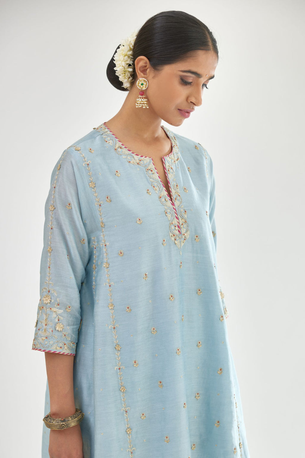 Blue silk chanderi short kalidar kurta set with all-over delicate zari bootis, detailed with dori embroidery and contrast bead work.