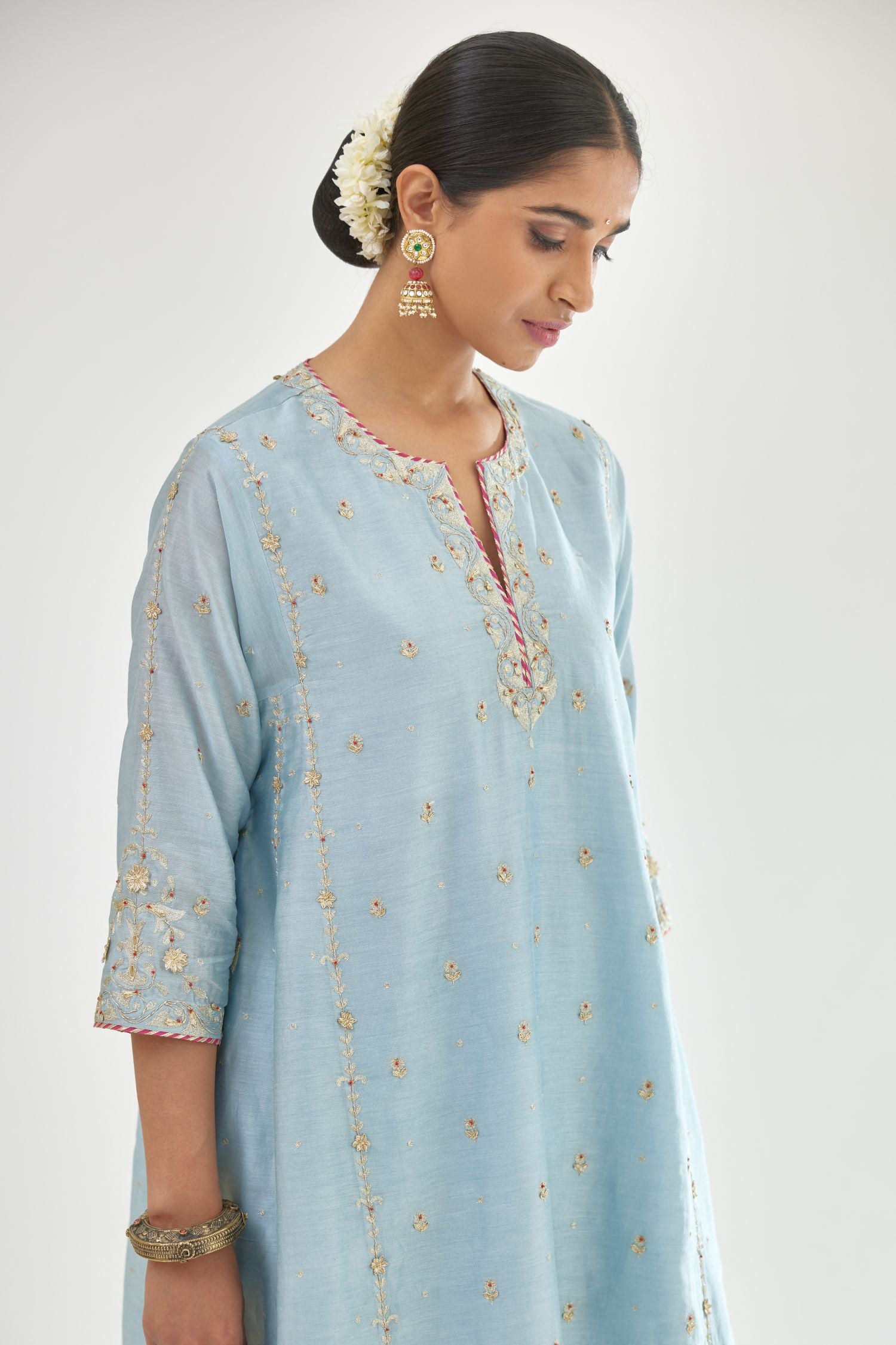 Blue silk chanderi short kalidar kurta set with all-over delicate zari bootis, detailed with dori embroidery and contrast bead work.
